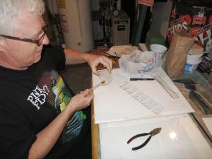 tapping under score to crack and break off