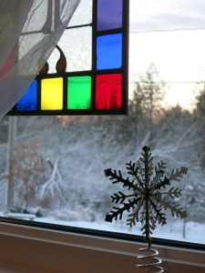 tree top snowflake inside, winter outside